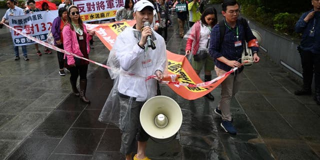 Protesters were allowed to chant slogans during the event, but were required to remain within a cordoned-off area while walking.