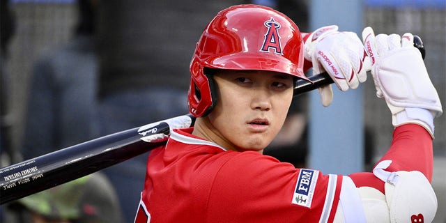 Shohei Ohtani of the Angels warms up during an exhibition game against the Dodgers at Dodger Stadium in Los Angeles on Sunday, March 26, 2023.