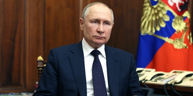Vladimir Putin sitting