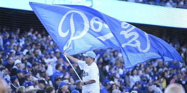 A Dodgers flag is flown on Opening Day