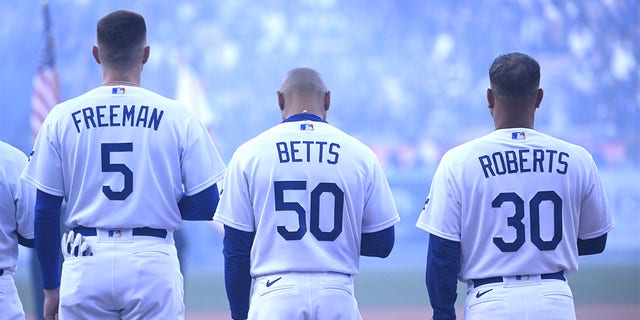 From left to right, Freddie Freeman, Mookie Betts and Dave Roberts prior to an Opening Day baseball game between the Los Angeles Dodgers and the Arizona Diamondbacks at Dodger Stadium in Los Angeles on Thursday, March 30, 2023.