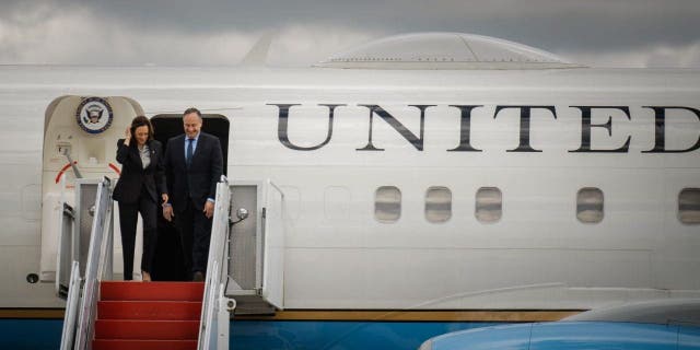 Vice President Kamala Harris and second gentleman Doug Emhoff disembark from Air Force Two at Kenneth Kuanda International Airport in Lusaka, Zambia, on Friday.