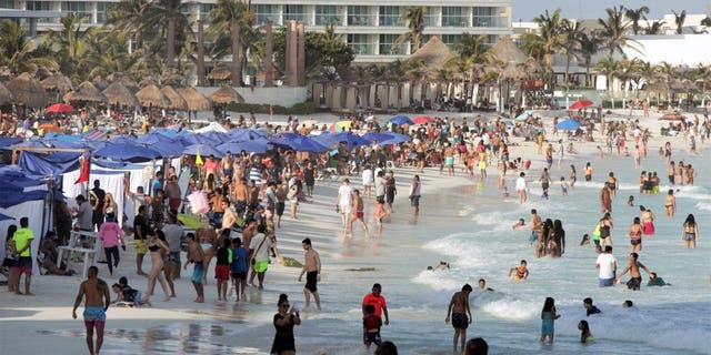 Beachgoers enjoy Forum Beach as tourism returns to the city during Holy Week April 3, 2021 in Cancun, Mexico. 