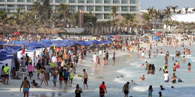 Bathers enjoy Forum Beach as tourism returns to the city during Holy Week on April 3, 2021 in Cancun, Mexico. Between March 29 and April 12, five health controls will be implemented in the hotel area of Cancun which include rapid and random COVID-19 tests to tourists.