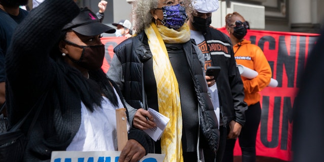 Social justice icon Angela Davis (center) at the May Day demonstrations along Market Street, Saturday, May 1, 2021, in San Francisco, Calif.