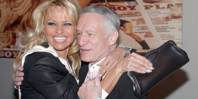 Pamela Anderson, left, and Hugh Hefner during the Hugh Hefner and International Images Launch the Playboy Legacy Collection.