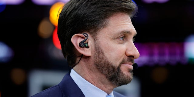 Mike Greenberg of ESPN looks on during a game between the Philadelphia 76ers and the Golden State Warriors at Wells Fargo Center on December 11, 2021 in Philadelphia, Pennsylvania.