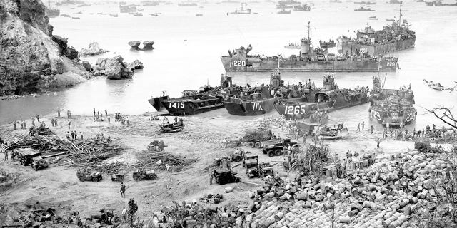 U.S. landing craft arrive on Okinawa 13 days into the American invasion, which began on April 1, 1945. 