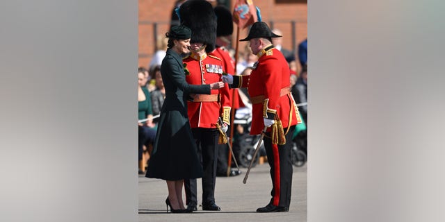 Princess Kate regularly meets with the Irish Guards and typically delivers the traditional shamrock to the regiment during its St. Patrick's Day parade as she did here in 2022.