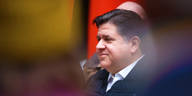 Illinois Gov. J.B. Pritzker listens to speakers during a transgender support rally at Federal Building Plaza April 27, 2022, in Chicago.