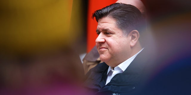 Illinois Gov. J.B. Pritzker listens to speakers during a transgender support rally at Federal Building Plaza April 27, 2022, in Chicago.