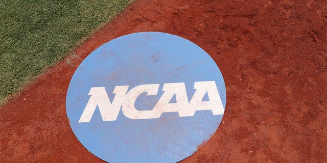 NCAA signage on the field before a game between the Oklahoma Sooners and the Ole Miss Rebels during the Division I men's baseball championship at Charles Schwab Field Omaha June 26, 2022, in Omaha, Neb.