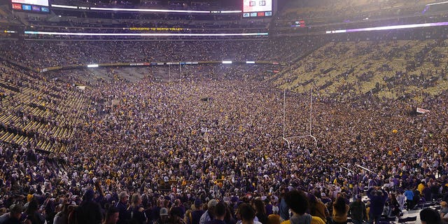 LSU fans storm the field to celebrates their win against the Alabama Crimson Tide at Tiger Stadium on Nov. 5, 2022, in Baton Rouge, Louisiana.