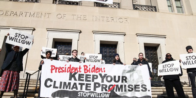 Climate activists urge President Biden to reject the Willow Project during a demonstration outside the Department of Interior on Nov. 17, 2022, in Washington, D.C.