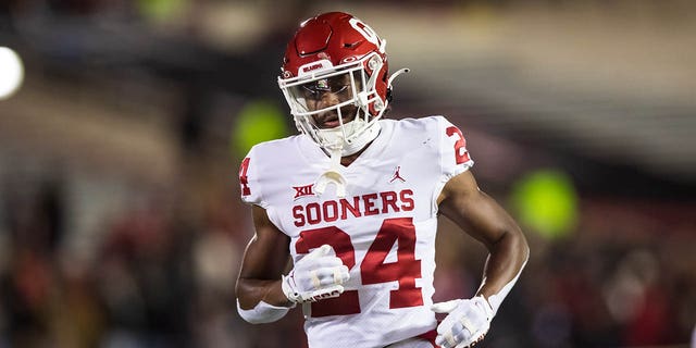 Defensive back Gentry Williams, #24 of the Oklahoma Sooners, runs across the field during the second half against the Texas Tech Red Raiders at Jones AT&T Stadium on Nov.  26, 2022 in Lubbock, TX.
