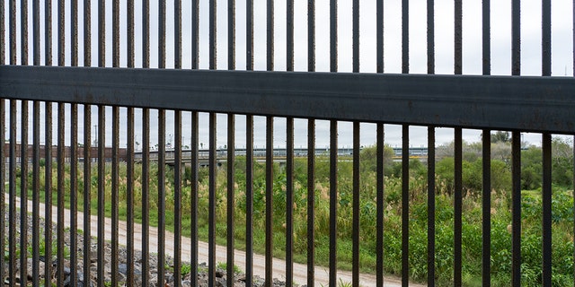 The Gateway International Bridge between Brownsville, Texas and Matamoros, Mexico seen through the border wall.  Seen from the side of the Texas Wall. 