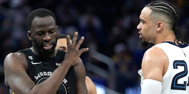 Draymond Green, #23 of the Golden State Warriors, and Dillon Brooks, #24 of the Memphis Grizzlies, exchange words during the second quarter at Chase Center on December 25, 2022, in San Francisco, California.  