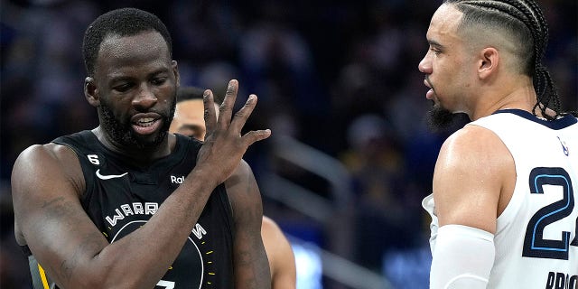 Draymond Green of the Golden State Warriors and Dillon Brooks of the Memphis Grizzlies exchange words at Chase Center on Dec. 25, 2022, in San Francisco.