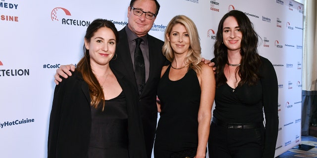 Bob Saget and his daughters Aubrey and Lara pose with Kelly Rizzo.