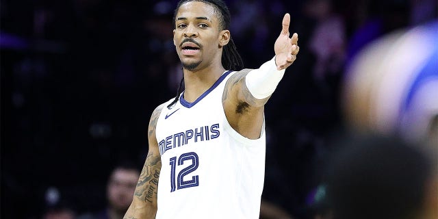 Ja Morant, #12 of the Memphis Grizzlies, reacts during the second quarter against the Philadelphia 76ers at the Wells Fargo Center on February 23, 2023 in Philadelphia.