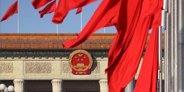 Chinese national flags are flown in Tian'anmen Square ahead of the two annual sessions on March 3, 2023 in Beijing. 