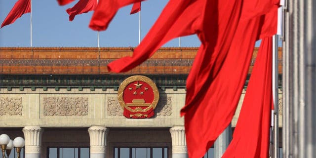 Chinese national flags are flown in Tian'anmen Square ahead of the two annual sessions on March 3, 2023 in Beijing. 