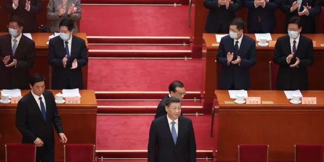 Li Zhanshu of National People's Congress (NPC), Chinese President Xi Jinping and Chinese Premier Li Keqiang attend the opening of the first session of the 14th Chinese People's Political Consultative Conference (CPPCC) at The Great Hall of People on March 4, 2023, in Beijing.