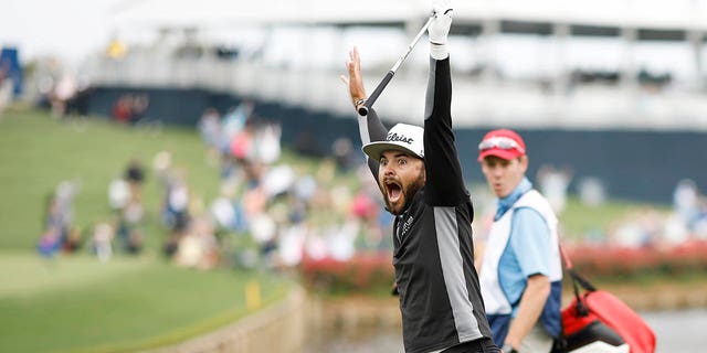 Hayden Buckley of the US celebrates making a hole-in-one on the 17th hole during the first round of the Players Championship March 9, 2023, in Ponte Vedra Beach, Fla. 