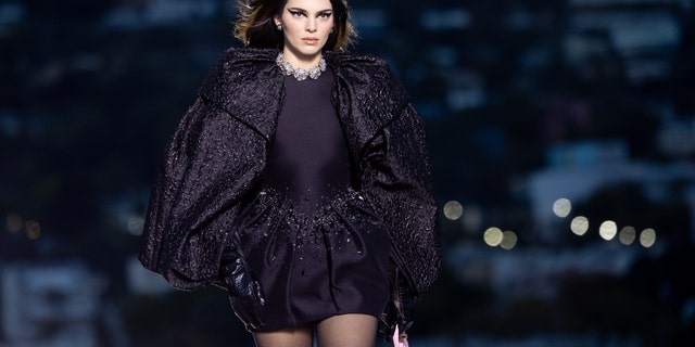 Kendall Jenner walks the runway during the Versace FW23 Show.