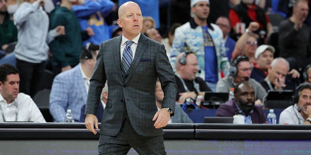 UCLA Bruins head coach Mick Cronin reacts after a dunk by Amari Bailey, #5, against the Arizona Wildcats was discounted for an offensive foul in the first half of the championship game of the Pac-12 basketball tournament at T-Mobile Arena on March 11, 2023 in Las Vegas. The Wildcats defeated the Bruins 61-59.