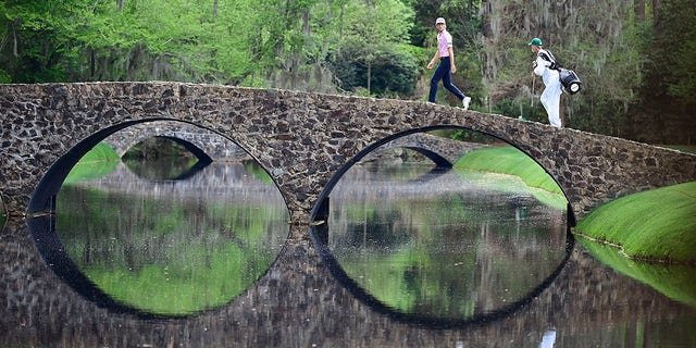 Will Zalatoris walks over the Hogan Bridge during the Masters at Augusta National Golf Club on April 11, 2021. 