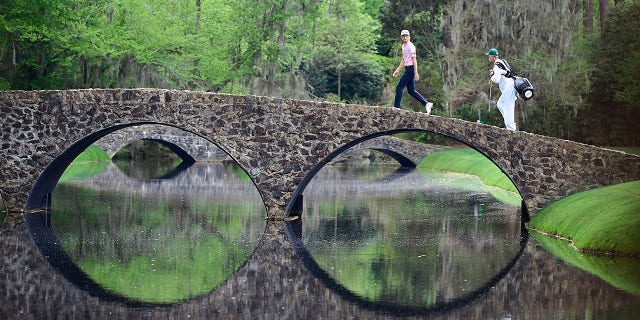 Will Zalatoris walks over the Hogan Bridge during the Masters at Augusta National Golf Club on April 11, 2021.