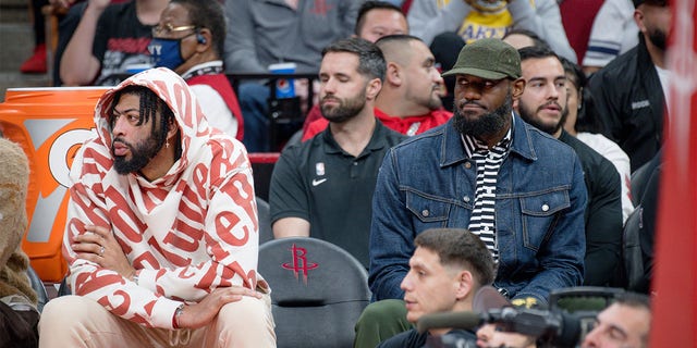 Anthony Davis, left, and LeBron James attend the game between the Los Angeles Lakers and the Houston Rockets at Toyota Center on March 15, 2023 in Houston.