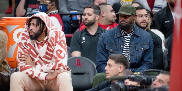 Anthony Davis, left, and LeBron James attend the game between the Los Angeles Lakers and the Houston Rockets at Toyota Center on March 15, 2023 in Houston.