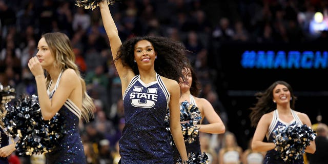 Utah State Aggies cheerleaders perform against the Missouri Tigers during the second half in the first round of the NCAA Men's Basketball Tournament at Golden 1 Center on March 16, 2023 in Sacramento, California.