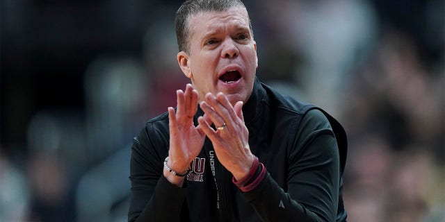 Tobin Anderson coaches in the tournament