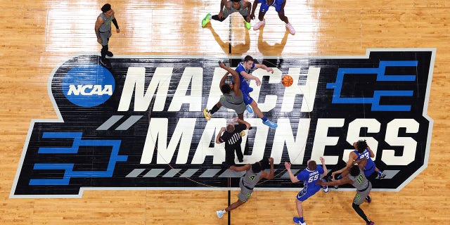 Ryan Kalkbrenner, #11 of the Creighton Bluejays, wins the opening tip over Flo Thamba #0 of the Baylor Bears in the second round of the 2023 NCAA Men's Basketball Tournament at Ball Arena on March 19 in Denver, Colorado.
