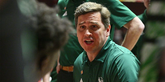 Head coach Mark Madsen of the Utah Valley Wolverines speaks to his team before their first round game against the New Mexico Lobos in the 2023 National Invitation Tournament at The Pit on March 15, 2023 in Albuquerque, New Mexico. 