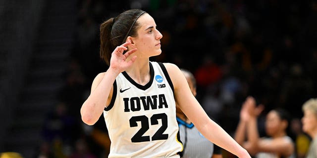 Caitlin Clark #22 of the Iowa Hawkeyes reacts during the fourth quarter of the game against the Louisville Cardinals in the Elite Eight round of the NCAA Women's Basketball Tournament at Climate Pledge Arena on March 26, 2023 in Seattle, Washington. 