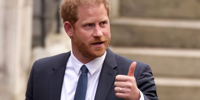 Prince Harry gives a thumbs up outside the Royal Courts of Justice on March 27, 2023 in London, England.