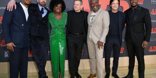 The cast of "Air," from left to right, Marlon Wayans, Ben Affleck, Viola Davis, Matt Damon, Julius Tennon, Jason Bateman and Chris Tucker, posed together at the premiere Monday night.