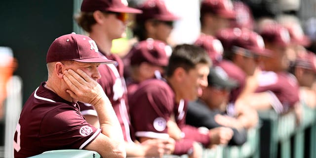 Texas A&M Aggies head coach Jim Schlossnagle watches their game against the Tennessee Volunteers from the dugout in the ninth inning at Lindsey Nelson Stadium on March 25, 2023 in Knoxville, Tennessee.