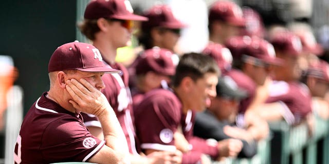 Texas A&M Aggies head coach Jim Schlossnagle watches their game against the Tennessee Volunteers from the dugout in the ninth inning at Lindsey Nelson Stadium on March 25, 2023 in Knoxville, Tennessee.