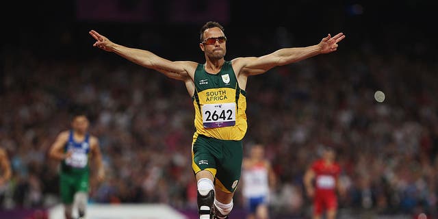 LONDON, ENGLAND - SEPTEMBER 08:  Oscar Pistorius of South Africa celebrates as he wins gold in the Men's 400m T44 Final on day 10 of the London 2012 Paralympic Games at Olympic Stadium on September 8, 2012 in London, England.  (Photo by Michael Steele/Getty Images)