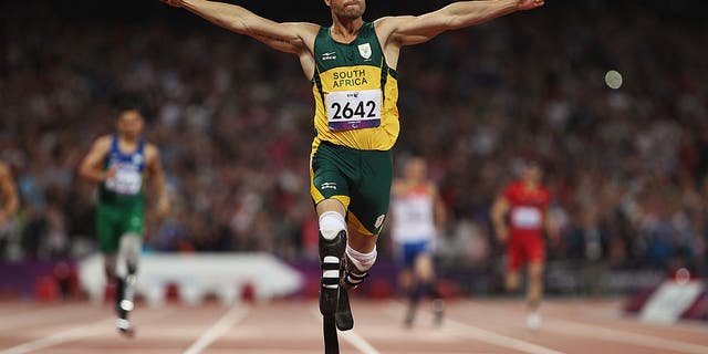 LONDON, ENGLAND - SEPTEMBER 08: Oscar Pistorius of South Africa celebrates as he wins gold in the Men's 400m T44 Final on day 10 of the London 2012 Paralympic Games at Olympic Stadium on September 8, 2012 in London, England. (Photo by Michael Steele/Getty Images)