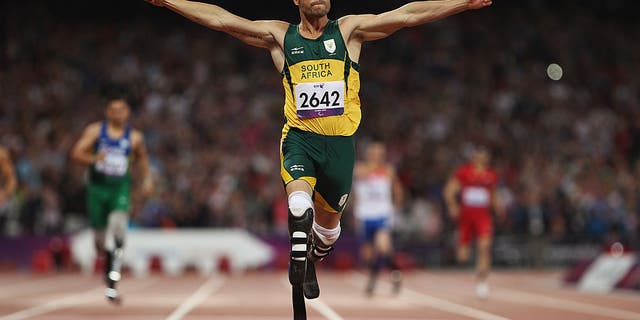 LONDON, ENGLAND - SEPTEMBER 08:  Oscar Pistorius of South Africa celebrates as he wins gold in the Men's 400m T44 Final on day 10 of the London 2012 Paralympic Games at Olympic Stadium on September 8, 2012 in London, England.  (Photo by Michael Steele/Getty Images)