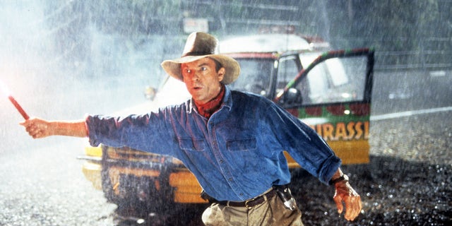 Neill holds a flare in a scene from the 1993 film "Jurassic Park."