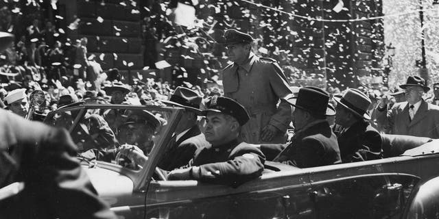 General Douglas MacArthur seen riding down Broadway, in New York City, during his official welcome to the city, having been relieved of his Asia commands by President Harry Truman.
