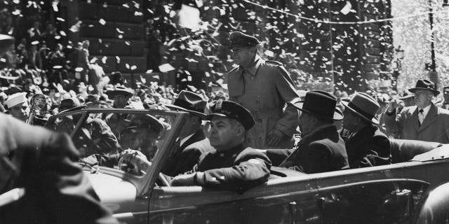 General Douglas MacArthur seen riding down Broadway, in New York City, during his official welcome to the city, having been relieved of his Asia commands by President Harry Truman.