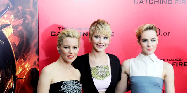 Elizabeth Banks, Jennifer Lawrence and Jena Malone attend the "Hunger Games: Catching Fire" New York premiere at AMC Lincoln Square Theater on Nov. 20, 2013.